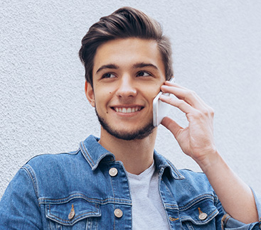 Man on phone smiling